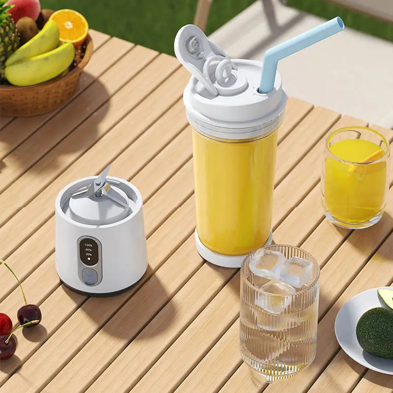 White portable blender with a light blue straw and a digital display, sitting on a wooden table with fresh fruit.