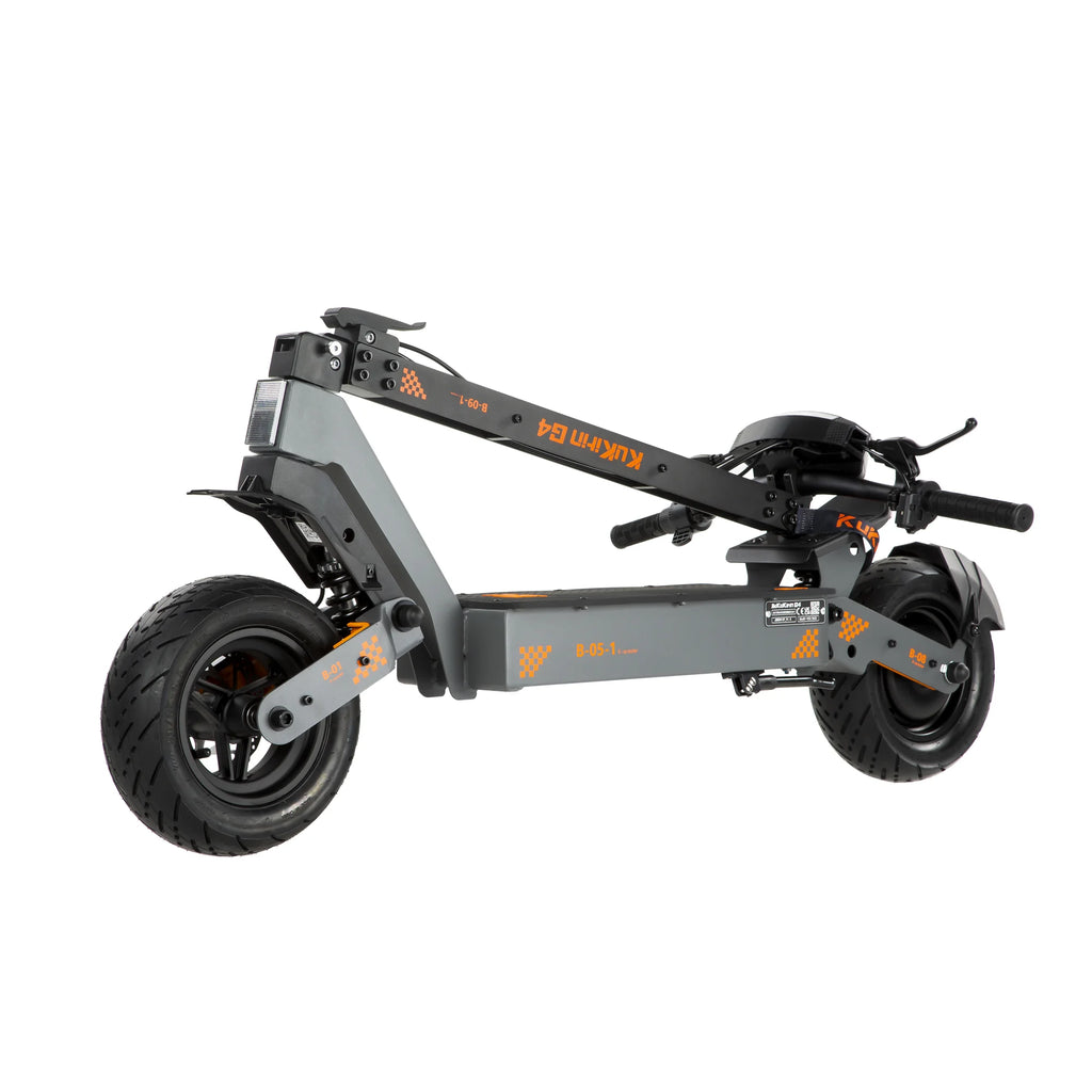 Folded grey KuKirin G4 electric scooter with orange accents and thick tires.