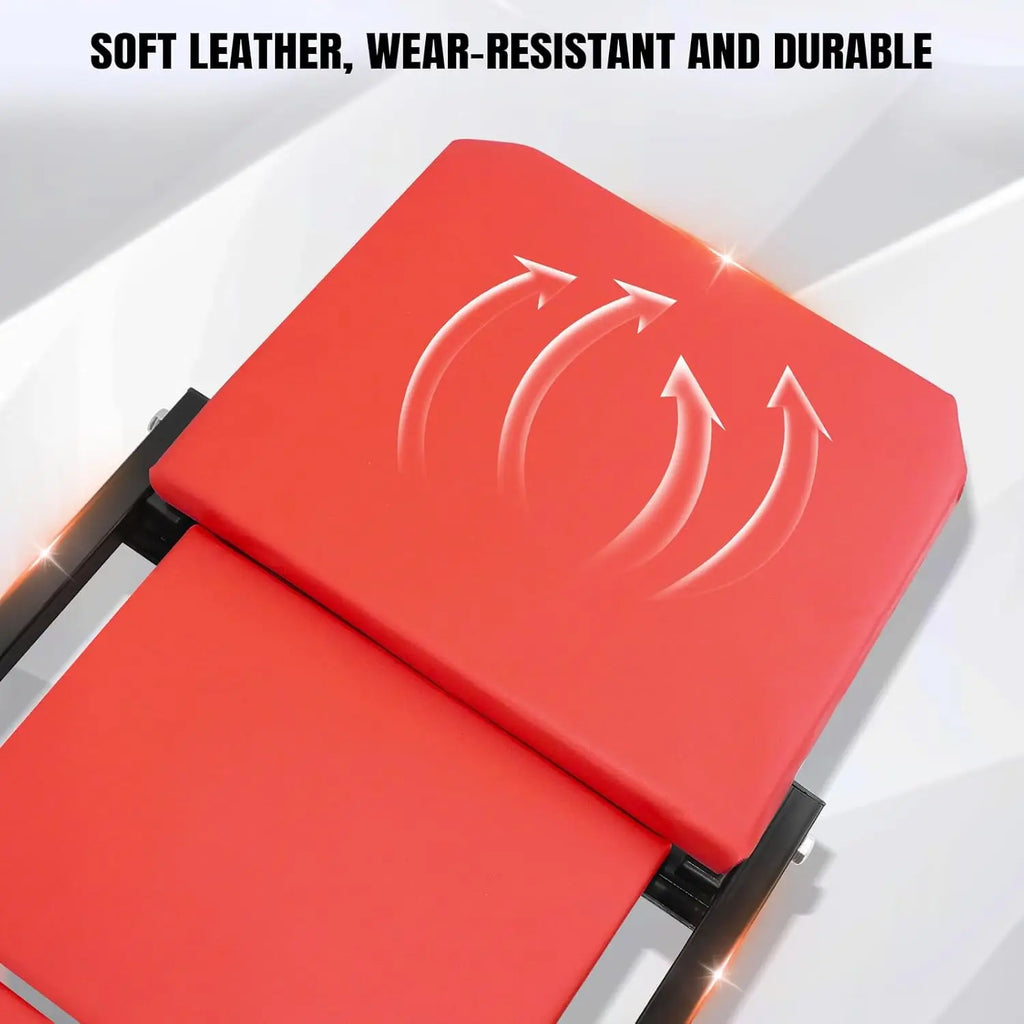 Red padded leather cushion on a folding car creeper with a black metal frame.
