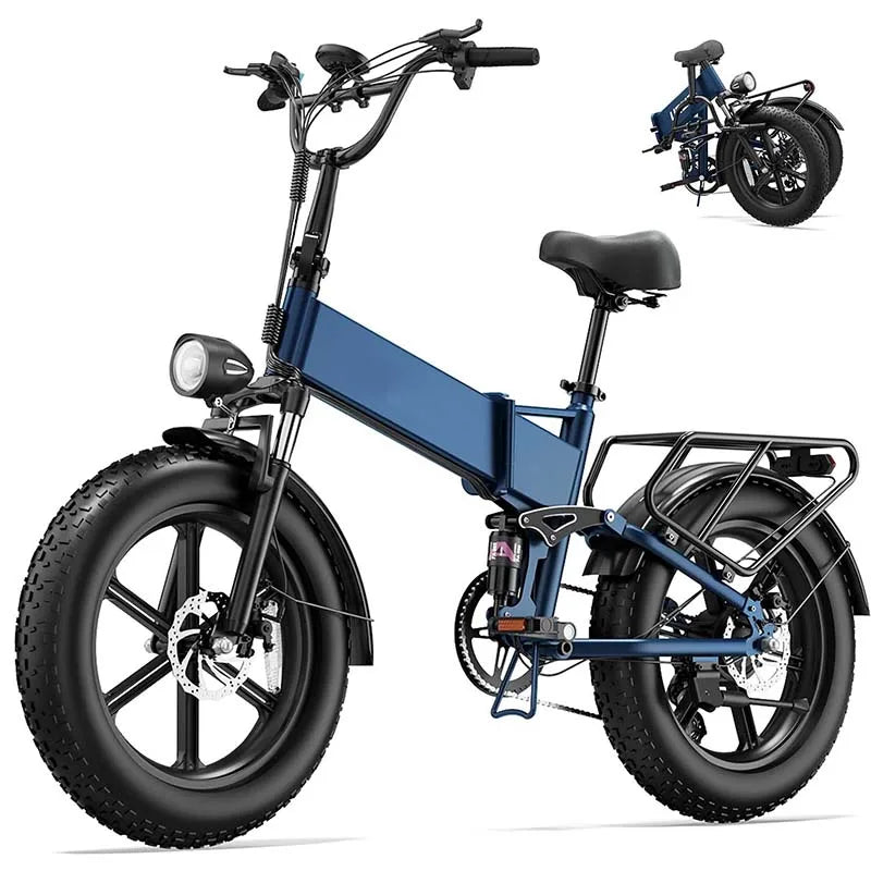 Blue electric mountain bike with thick fat tires, front headlight, rear rack, and a foldable frame design.