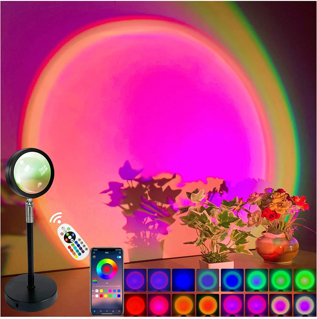 Smart sunset LED lamp casting a pink and orange circular light, with a remote control and app interface shown.