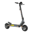 Dark gray adult electric scooter with large tubeless tires, orange accents, dual disc brakes, and wide deck.