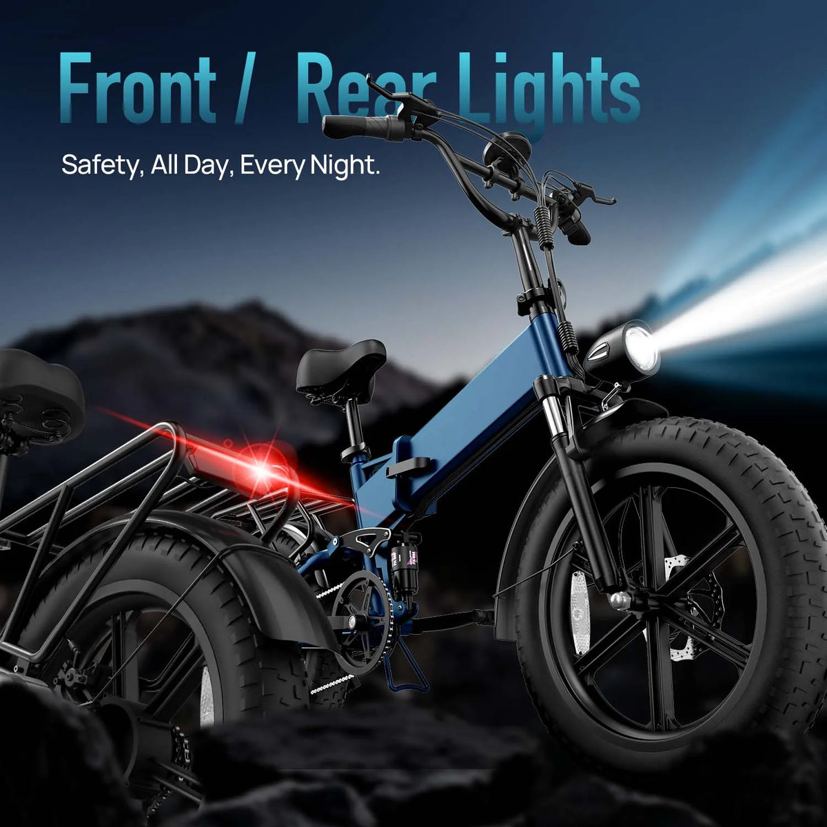 Blue foldable electric mountain bike with thick tires, bright front headlight, and red rear light.