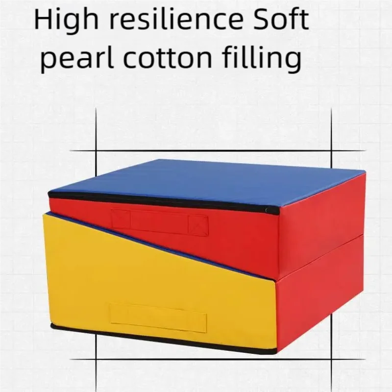 Foldable gymnastics wedge mat in primary blue, red, and yellow with soft pearl cotton filling and carry handles.