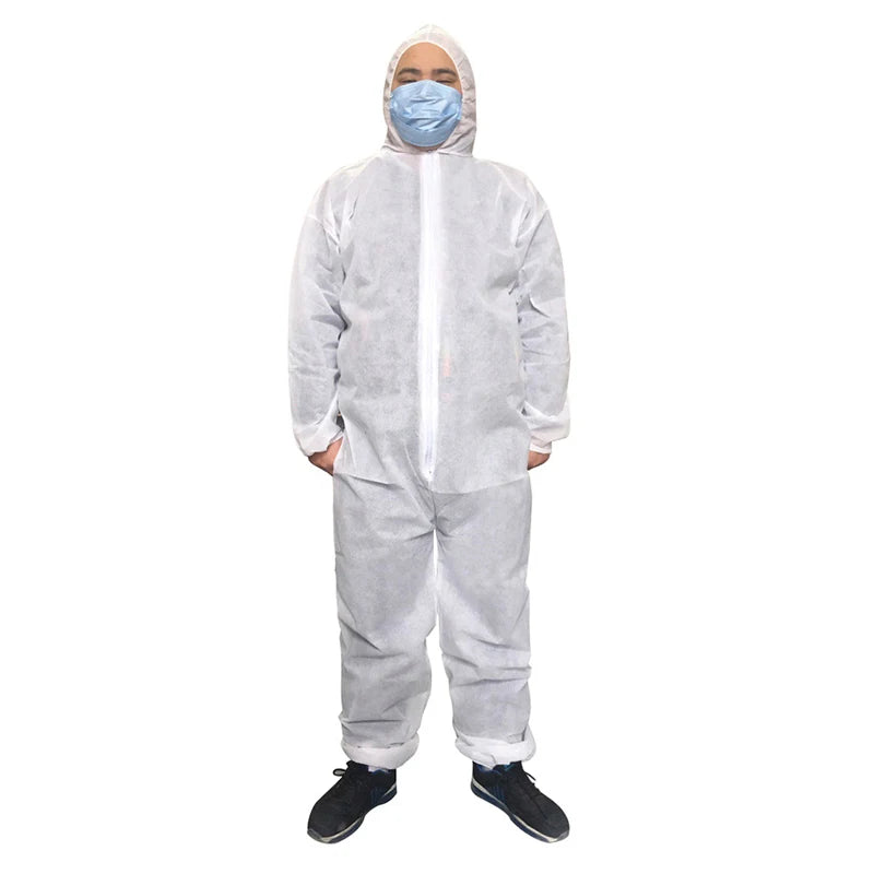 Person wearing a white hooded disposable protective coverall with a front zipper, made of non-woven material.