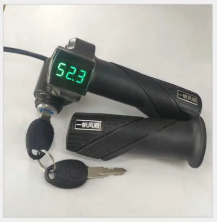 Black electric bike twist throttle handle with green digital voltage display, ignition lock, and keys.
