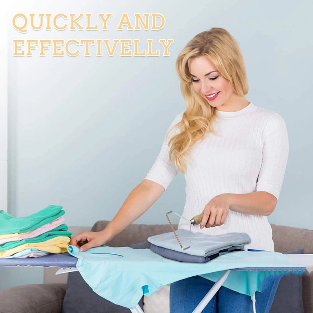 A blonde woman using a portable wooden-handled metal lint remover on a folded blue garment on an ironing board.