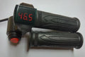 Black electric bike twist throttle set with textured rubber grips, a red digital voltage display, and a red power switch.