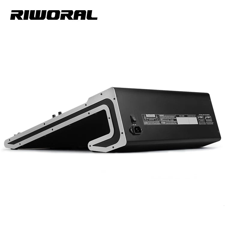 Side view of a sleek, black 24-channel digital audio mixer with silver side panels and rear power input and switch.