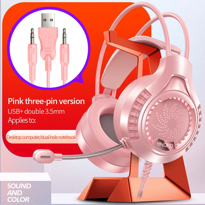 Pink RGB gaming headset with microphone on a stand, featuring USB and dual 3.5mm jack connectors.
