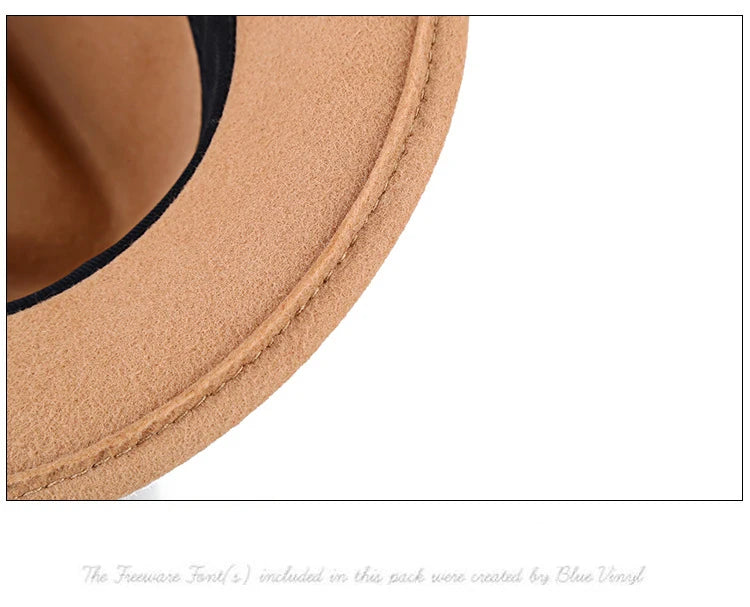 Close-up of a tan wool felt fedora hat featuring a stitched brim edge and a black internal lining.