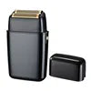 Sleek black professional electric foil shaver with a gold-tone blade head and a matching protective cap.