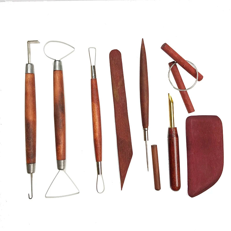 Set of professional clay sculpting tools with dark wood handles and stainless steel metal tips.