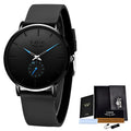 Black LIGE ultra-thin quartz watch with round dial, blue hands, subdial, and black silicone strap next to a box.