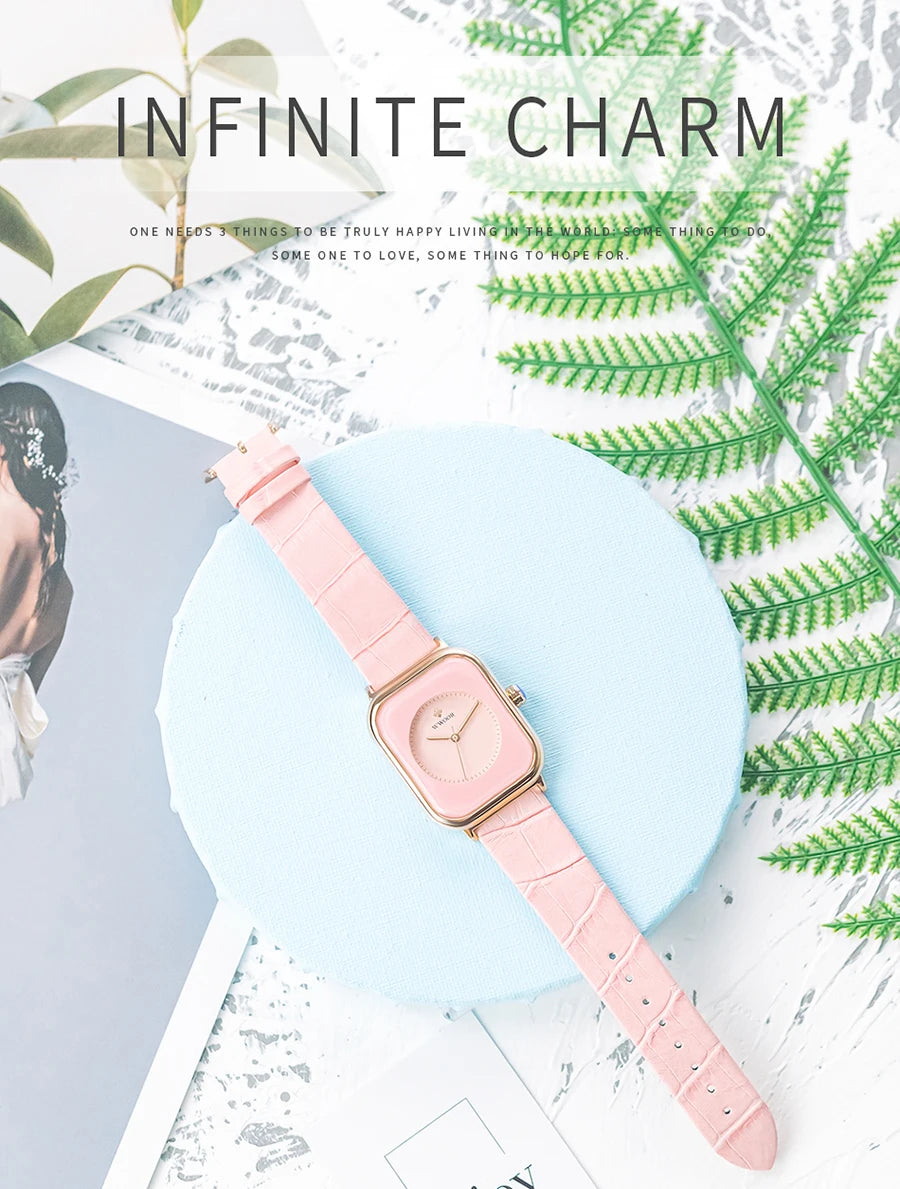 Ladies' watch with a square pale pink dial, rose gold case, and a textured pink faux-leather strap.