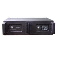 Black, rectangular professional stage speaker with side handles and rear input panels for a passive line array system.