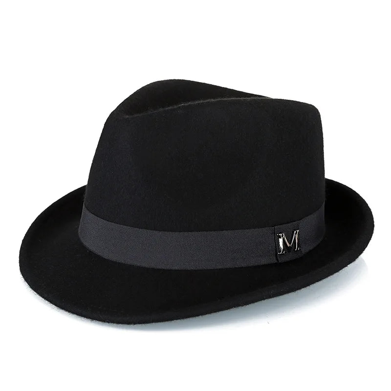 Black wool felt fedora with a matching grosgrain ribbon band and a silver metal initial emblem.