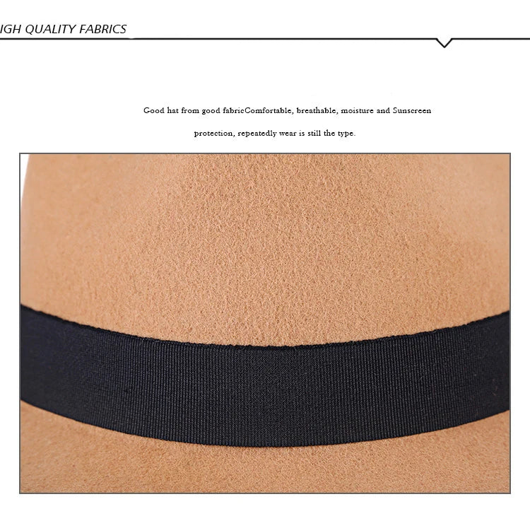 Close-up of a tan wool felt fedora with a black grosgrain ribbon band.