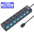 Black 7-port USB hub with individual power switches, blue LED indicators, and an integrated 44cm connection cable.