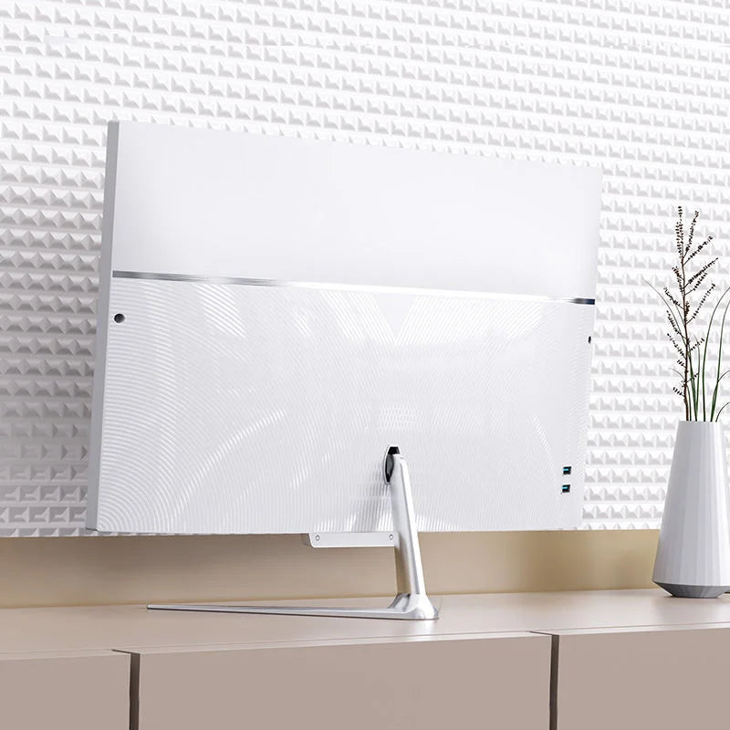 Back view of a slim, white 21.5-inch all-in-one desktop PC with a sleek metallic stand on a modern desk.
