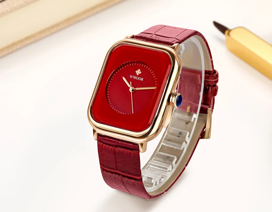 Ladies’ square watch with a gold-tone case, deep red dial, and matching red crocodile-effect leather strap.