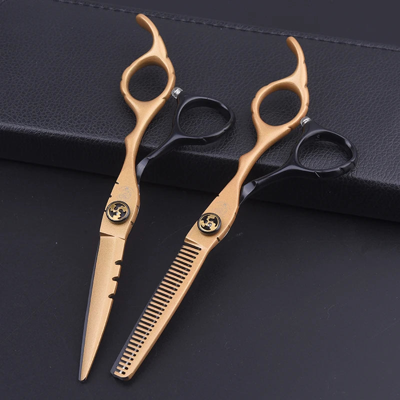 Professional 6-inch hairdressing scissors and thinning set in gold and black with ergonomic finger rests.