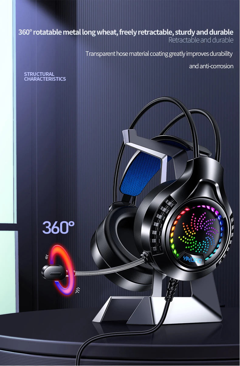 Black wired gaming headset with RGB lighting, cushioned blue headband, and a 360-degree rotatable microphone on a stand.