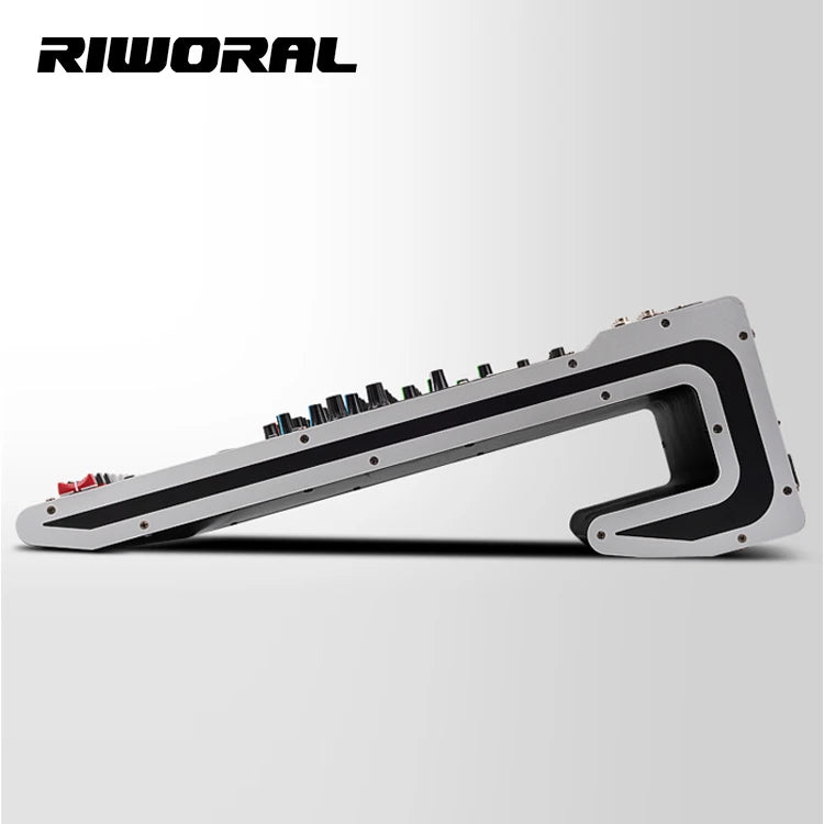 Side view of a sleek, silver and black 24-channel digital audio mixer with a modern, angled desktop design.