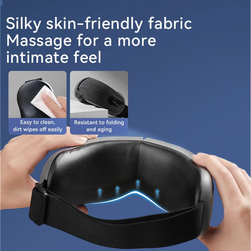 Smart heated eye massager with a sleek grey finish, adjustable strap, and easy-clean, soft black inner lining.