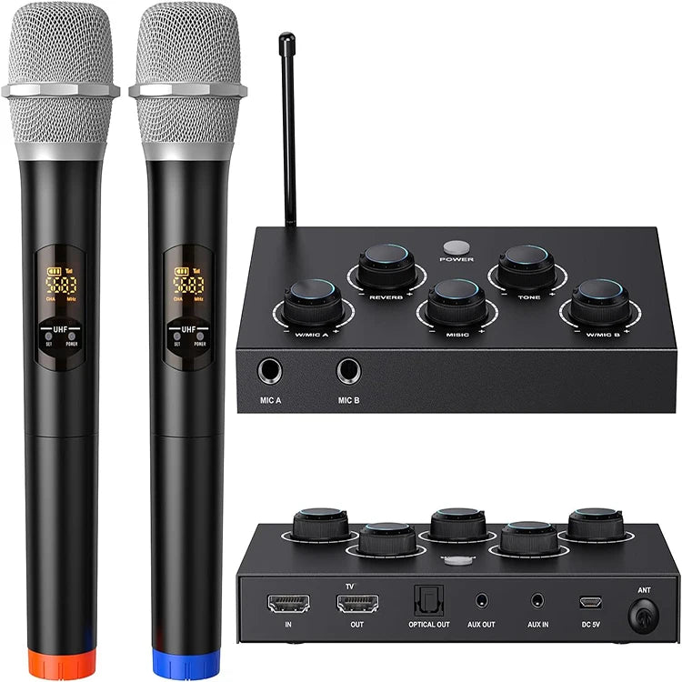 Two black wireless microphones with digital displays beside a control mixer featuring multiple audio input and output ports.
