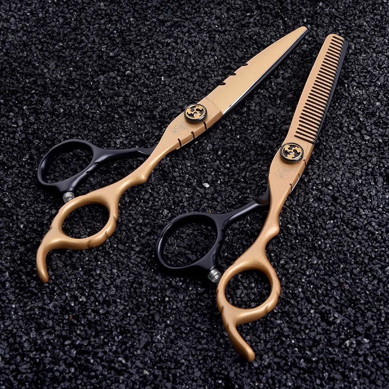 Six-inch gold and black professional hairdressing scissors and thinning shears with decorative tension screws.