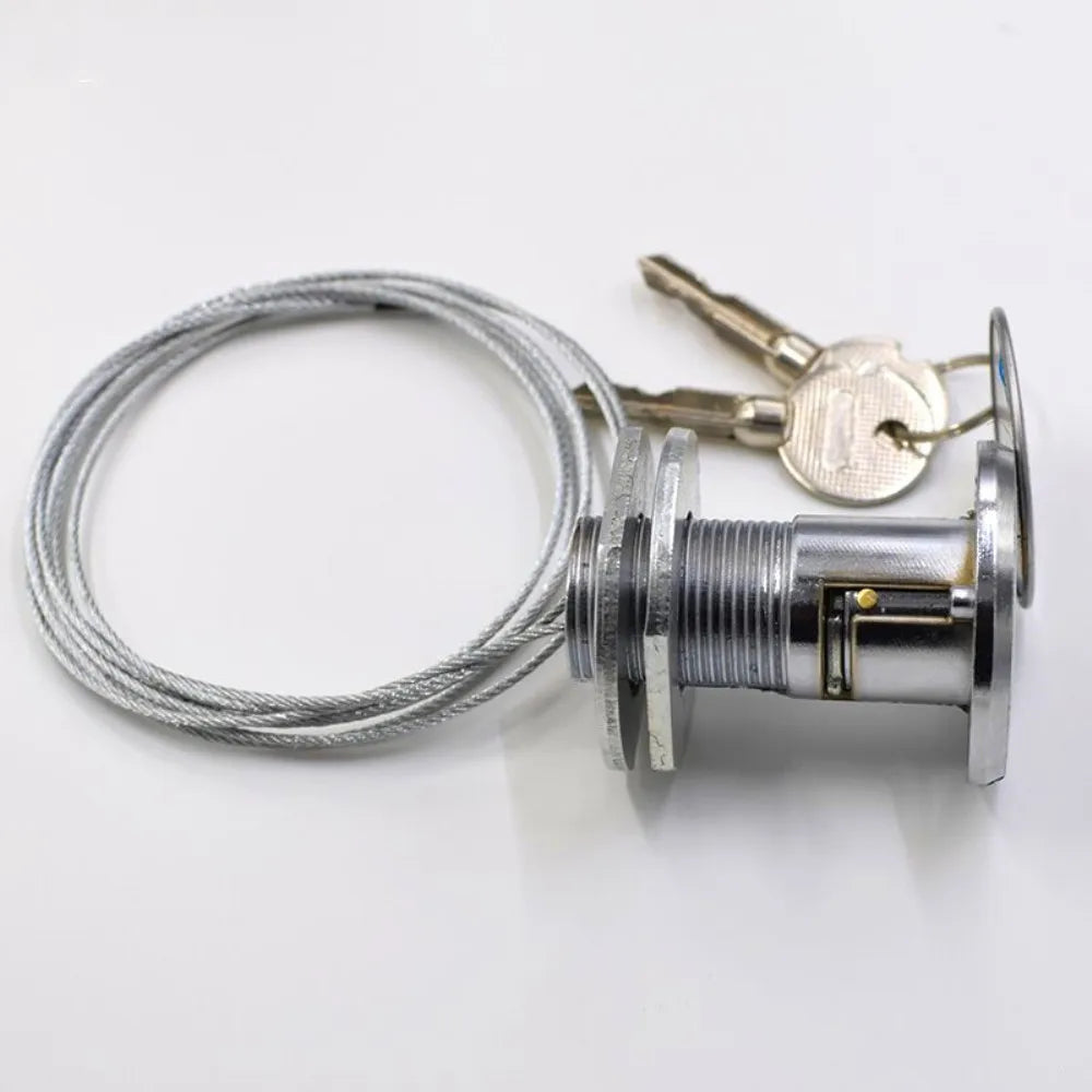 Silver metal cylinder cam lock with threaded body, attached steel cable, and two keys on a white background.