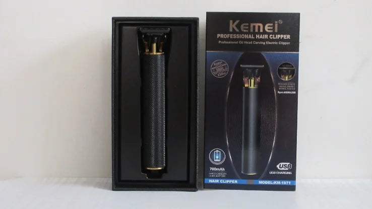 Black cordless rechargeable hair trimmer with T-blade, textured grip, and presentation box.