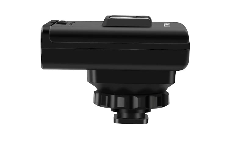 Black plastic camera cold shoe adapter with a locking nut and mounting bracket, side view.