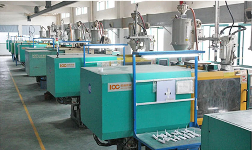 The provided image does not show a hair clipper. It displays an industrial manufacturing factory floor with machinery.