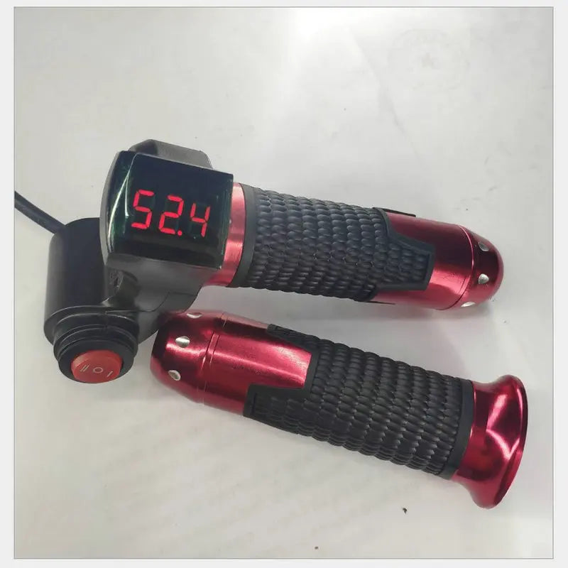Red and black electric bike twist throttle with textured rubber grips, red power switch, and digital LCD battery display.