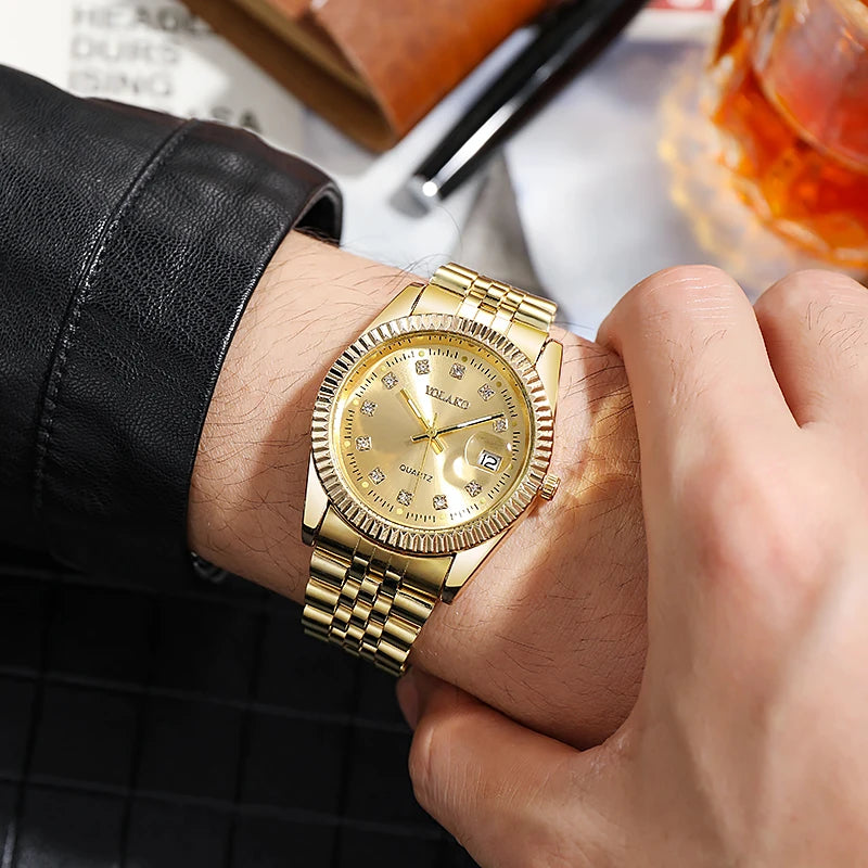 Men's luxury gold-tone quartz watch with a fluted bezel, diamond-style hour markers and a date window on the wrist.