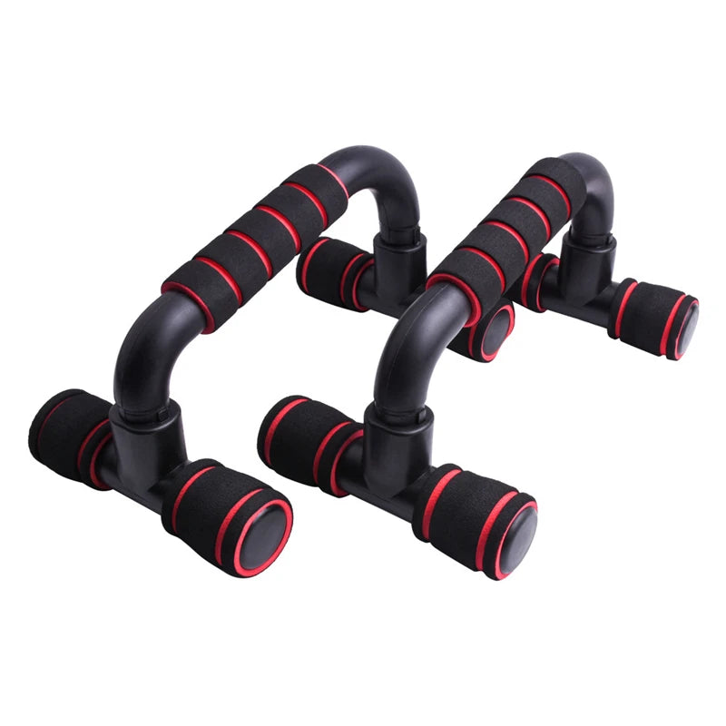 Pair of black and red foam-grip push-up bars for exercise, isolated on a white background.