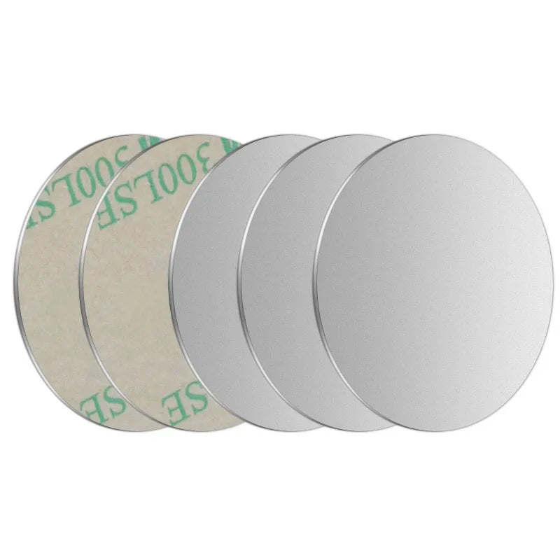 Set of five smooth, silver, circular metal adhesive discs with green backing paper visible on the rear sides.
