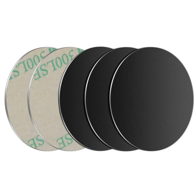 Five circular black adhesive metal discs, arranged in a row showing both the black side and the beige adhesive back.
