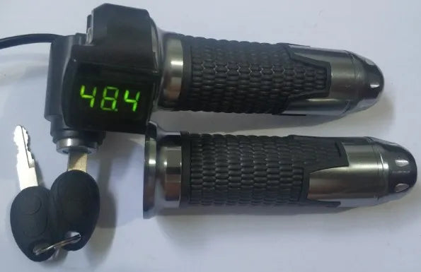 Black and chrome electric bike twist throttle with digital voltage display and two ignition keys.