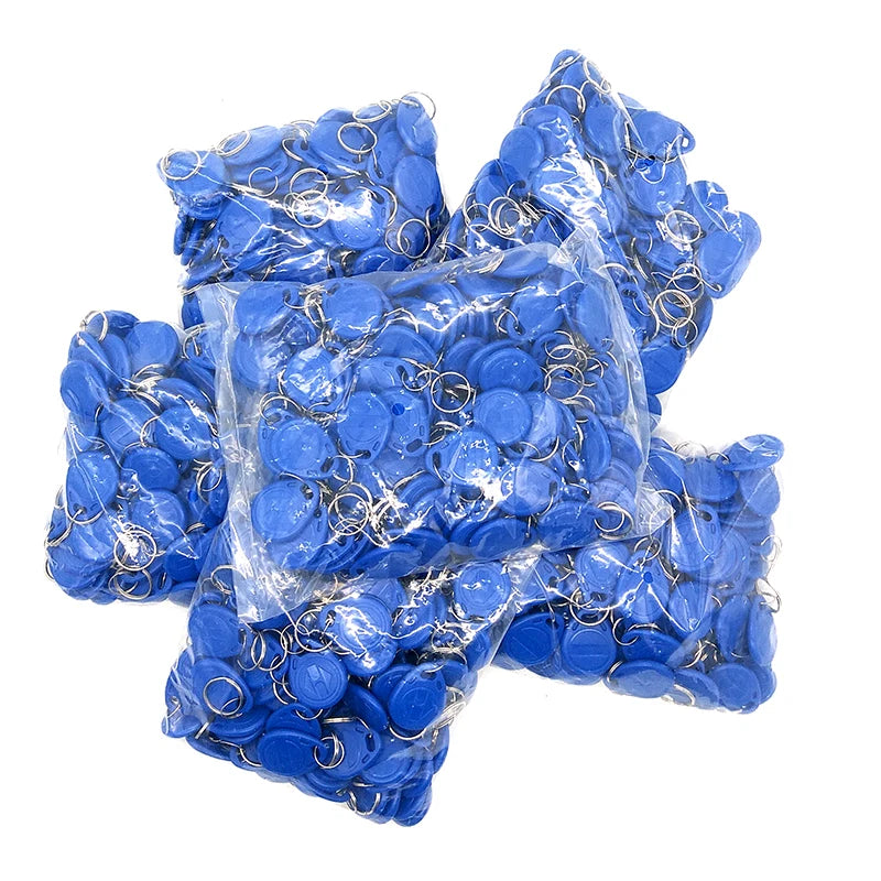 Blue plastic RFID key fob tags with metal rings, packed in several clear plastic bags.