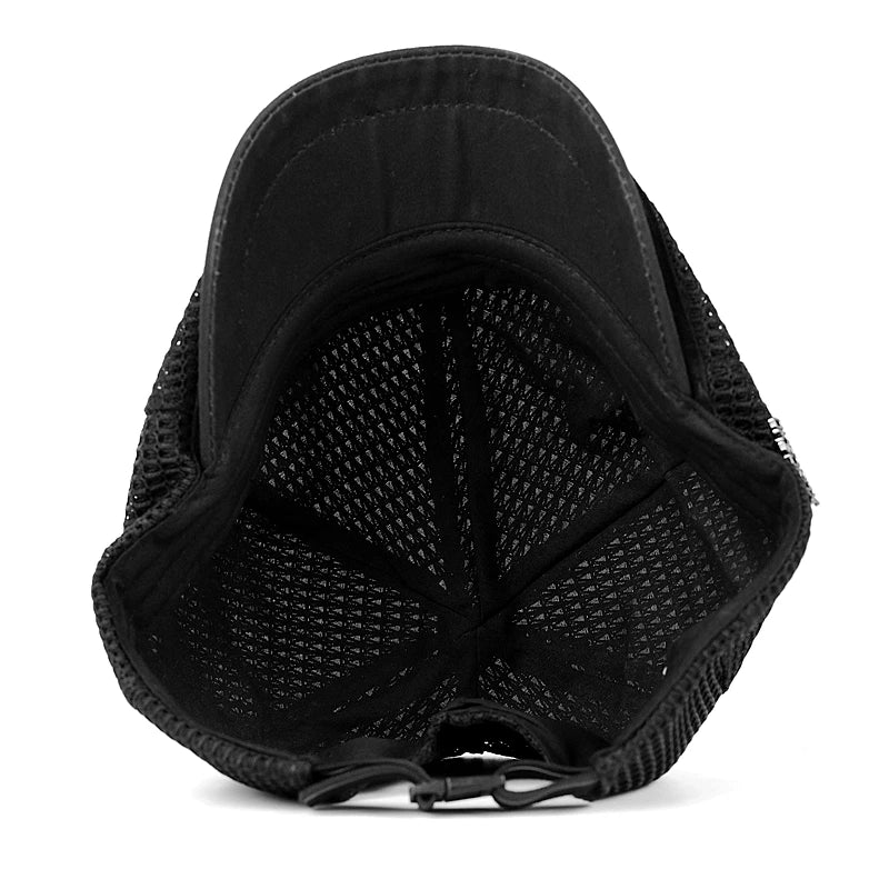 Inside view of a black unisex flat cap, featuring a lightweight, breathable mesh construction and adjustable strap.