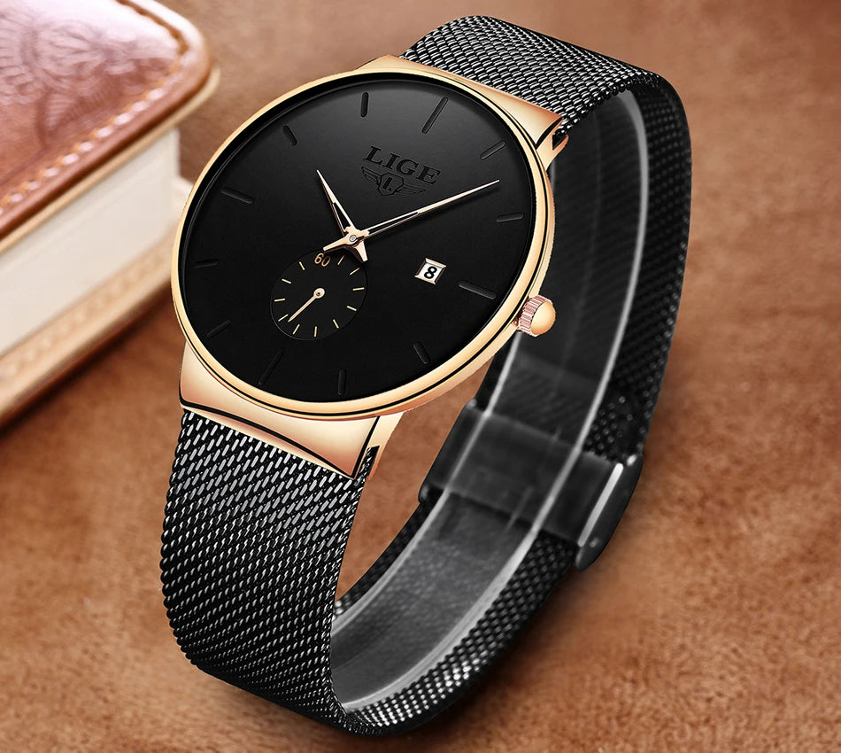 Elegant women’s quartz watch with a black dial, gold-tone case, and black mesh stainless steel strap.
