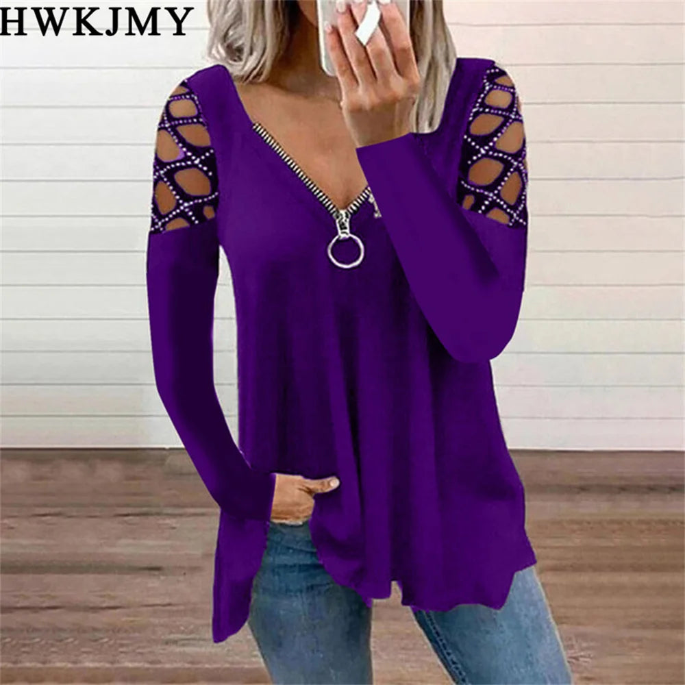 Purple long-sleeve top with a zip-up V-neck and decorative cut-out lattice detailing on the shoulders.
