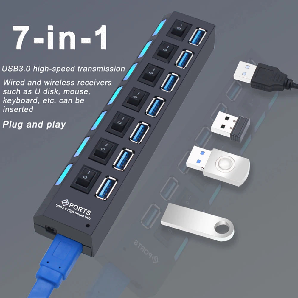 Black 7-port USB 3.0 hub with individual power switches and blue LED accents. Includes USB cables and drives.
