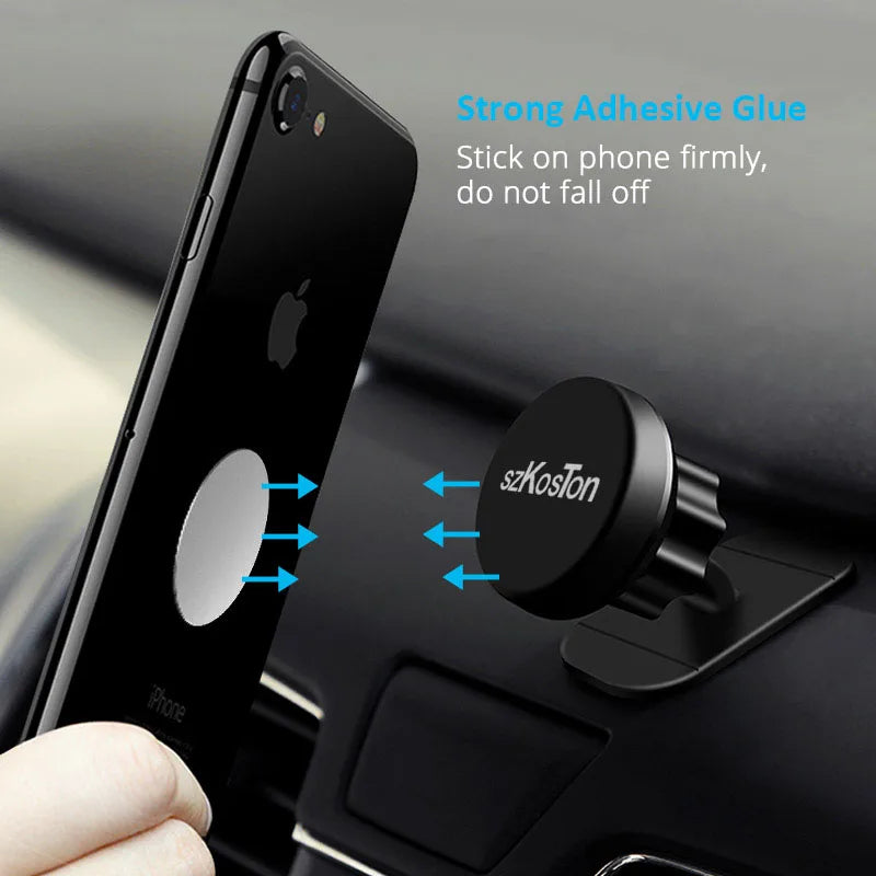 Black magnetic phone mount for car dashboard, featuring a circular adhesive design for a secure grip.