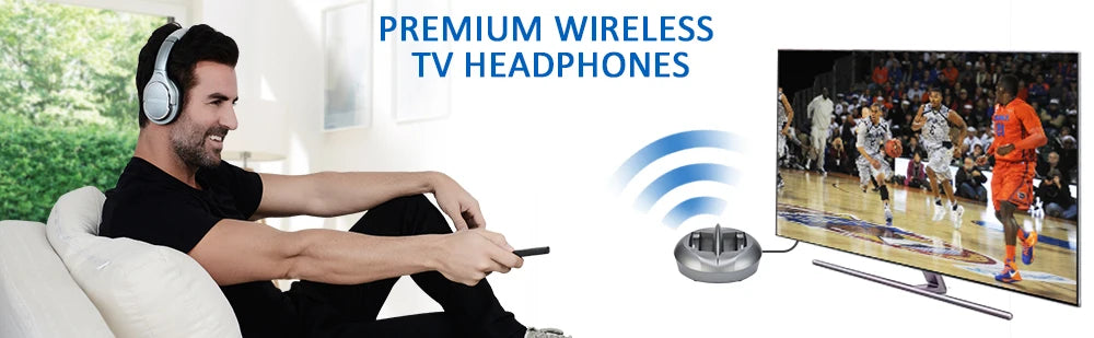 Man wearing silver wireless over-ear headphones, using a remote to watch basketball on TV via a charging transmitter.