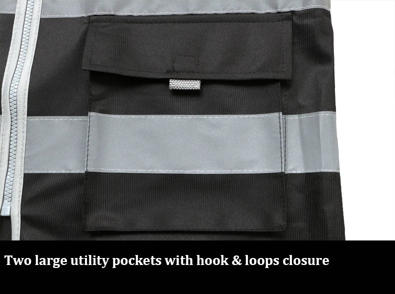 Close-up of a black high-visibility work vest featuring reflective strips, a zip fastening, and large utility pockets.