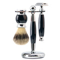 A men’s wet shaving set with a chrome and black handle safety razor and brush on a matching polished chrome stand.
